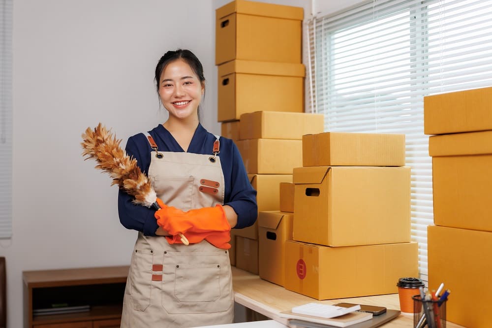 smiling-female-employee-holding-feather-duster-nea-2025-09-14-19-58-17-utc